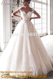 Bling Ball Gown Wedding Dresses Nude Tulle Neck Cap Sleeves Lace Applique Corset Buttons Sweep Train Bridal Gowns