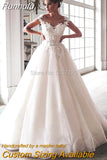 Bling Ball Gown Wedding Dresses Nude Tulle Neck Cap Sleeves Lace Applique Corset Buttons Sweep Train Bridal Gowns